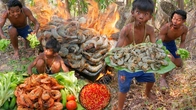 Survival in the rainforest - Primitive Boy cooking shrimp on the rock eating delicious
